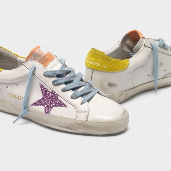 Women's Golden Goose superstar sneakers with pink glittery star and yellow